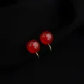 Close-up of wine red round clip-on earrings, vintage gold plated non-pierced design detail. - Wine Red 10mm Red Agate Mosquito Coil Clip