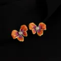 Detail shot of vintage style gradient orange enamel flower clip-on earrings with crystal center. - Wine Red Gradient Iris Mosquito Coil Clip