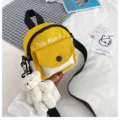 Canvas mini crossbody backpack in yellow and white with cute plush bear pendant and front pocket. - Yellow