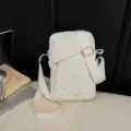 Canvas crossbody phone bag featuring star pattern, casual shoulder bag for daily commute. - Off White