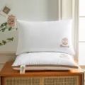 Hotel quality white pillow core pair with elegant embroidery and brown piping for comfortable sleep. - 900g High Pillow - 1 Pack / Rose Gold Trim