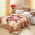Detailed view of the winter thick Raschel plush blanket with traditional floral pattern. - Love Lily - Camel
