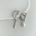 Exquisite asymmetrical liquid metal earrings featuring elegant pearl pendants for chic style. - A975 Asymmetric Butterfly Wings