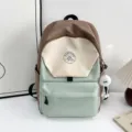 Details of the Japanese patchwork backpack with cute fuzzy pendant and front zip pocket. - Style Without Pendant / Green Large