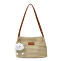 Elegante borsa a spalla in paglia intrecciata con manici in pelle e ciondolo nuvola dolce. - Borsa Singola / Kaki