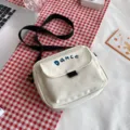 Solid color nylon crossbody bag for women, cute Japanese style casual messenger shoulder bag. - White