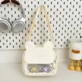 Cute canvas crossbody ita bag with rabbit ears and front mesh pocket for women and teens. - White