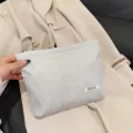 Silver glitter cosmetic pouch, stylish portable makeup clutch bag for daily storage needs. - Silver