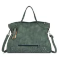 Close-up detail of retro green PU leather shoulder bag with chic metal studs and stylish tassel. - Green