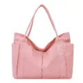 Pink canvas tote bag with large capacity, multiple pockets and durable shoulder straps. - Pink