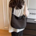 Black solid color soft canvas shoulder crossbody bag, large capacity casual tote bag variant. - Black
