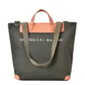 Green canvas tote bag for women, multi-use casual shoulder handbag with leather trim and straps. - Green