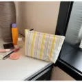 Striped bubble makeup pouch detailed view, soft fabric cosmetic organizer bag for daily essentials. - Yellow Colorful Stripes