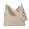 Beige PU leather shoulder bag for women, casual crossbody tote with wide strap and pocket. - White