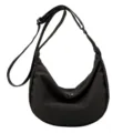 Black nylon crossbody bag for women, casual minimalist dumpling shoulder bag with adjustable strap. - Black