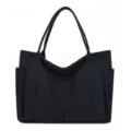 Black canvas tote bag detail view, large capacity casual daily shoulder bag design - Black