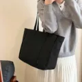 Large capacity black canvas tote bag, stylish shoulder bag for daily commute and school. - Black