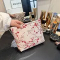 Large capacity embroidered cosmetic bag with plum blossom pattern for travel use. - Gold Wire Red Plum