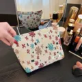Linen jacquard cosmetic bag travel toiletry pouch with floral pattern and zipper closure. - Jacquard Linen Petals White