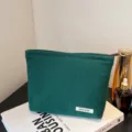 Solid color corduroy cosmetic bag, portable zipper makeup pouch and daily storage clutch. - Dark Green