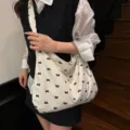Korean lazy style canvas shoulder tote bag with cute black bow print for women daily casual use. - Bow