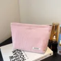 Pink corduroy makeup bag for women, cute zipper cosmetic pouch and travel toiletry organizer. - Light Pink