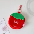 Cute red plush strawberry coin purse with green leaf top, metal keychain and smooth zipper. - Red