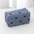 Blue corduroy makeup bag with cute black bow pattern and zip closure, daily cosmetic storage. - Sky Blue