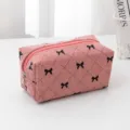 Pink corduroy cosmetic bag with black bow embroidery, cute travel makeup storage pouch for daily use. - Pink