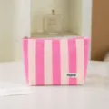 Pink striped cosmetic bag detail view showing soft terry cloth fabric and neat zipper closure for daily use. - Pink White Stripes