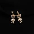 Detailed shot of gold-plated crystal teddy bear clip-on earrings, exquisite and elegant. - Non-pierced Spiral Clip-on Earrings / Bear Style