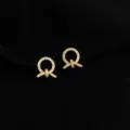 Detailed close-up of 18K gold-plated crystal paved knot clip-on earrings for non-pierced ears. - Rhinestone Knot Style
