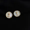 Elegant 18K gold-plated white shell rose earrings, chic clip-on design for non-pierced ears. - Rose Flower