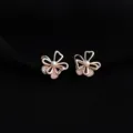 Elegant rose gold flower clip-on earrings with pearls and shimmering cubic zirconia stones. - Four-Leaf Flower Style