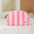 Detailed close-up of pink and white striped cosmetic storage pouch with zipper and custom label. - Pink White Stripes