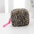 Cute leopard print plush cosmetic bag with pink knot zipper pull, compact storage pouch. - Black Square Bag