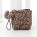 Fluffy leopard print cosmetic pouch with cute heart pendant and portable wrist strap. - Brown