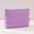 Purple quilted cosmetic pouch detail, soft puffy travel makeup bag texture display. - 25x17cm / Purple