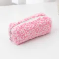 Detailed view of the pink plush leopard print pencil case, soft fabric and smooth zipper. - Rose Red