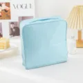 Light blue cosmetic bag, large capacity portable storage pouch for travel, makeup and daily essentials. - Light Blue