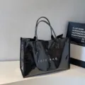 Black glossy PVC tote bag for women, large capacity commuter handbag with double top handles. - Black