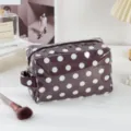 Waterproof PVC polka dot cosmetic bag with zipper and handle, perfect travel toiletry pouch. - Polka Dot Brown