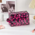 Waterproof PVC makeup bag with stylish pink leopard print, zipper and portable side handle. - Black Red Leopard