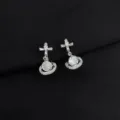 Detailed close-up of sparkling silver orb and cross earrings with brilliant cubic zirconia. - Zirconia Planet (W293)