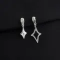 Close-up of asymmetric geometric star earrings, silver tone, detailed metal texture view. - Asymmetric Ear Clips (W464)