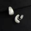 Matte silver teardrop clip-on earrings close-up, comfortable silicone cushion, detail view. - Brushed Silver Small Head Ear Clip (W469)