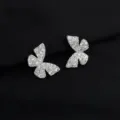 Sparkling pavé cubic zirconia butterfly ear clips detail view, elegant silver tone jewelry. - Zirconia Bowknot Ear Clip (W485)