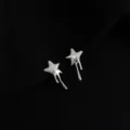 Silver-tone melting star clip-on earrings with micro-pave zirconia, unique drip design. - Double Layer Clip-On Earrings / Zirconia Lava Star