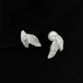 Close-up detail of silver-toned double leaf crystal clip-on earrings for non-pierced ears. - Double Layer Clip-On Earrings / Blue Leaf