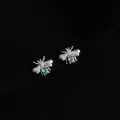 Silver bee stud earrings featuring sparkling light blue crystal bodies, elegant and stylish. - Double Layer Clip-On Earrings / Firefly